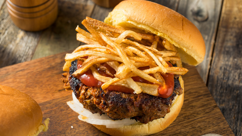 A Cuban hamburger on a wooden board