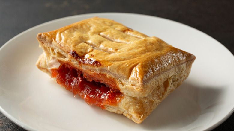 A guava pastry on a white plate
