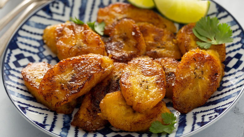 A plate of sliced and fried sweet plantains