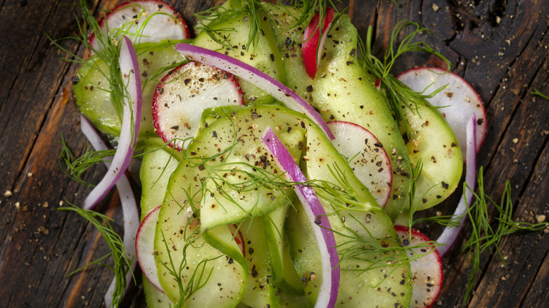 Cucumber salad with red onion, pickled radish and Maggi seasoning