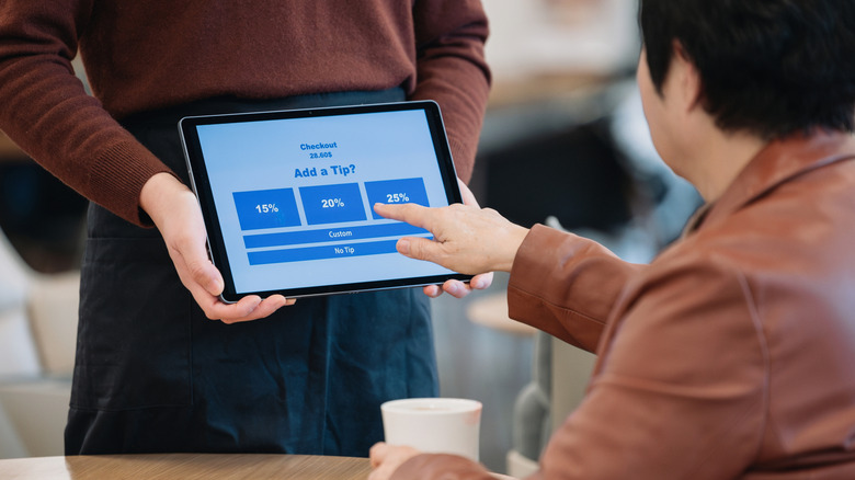 Person tipping on a screen
