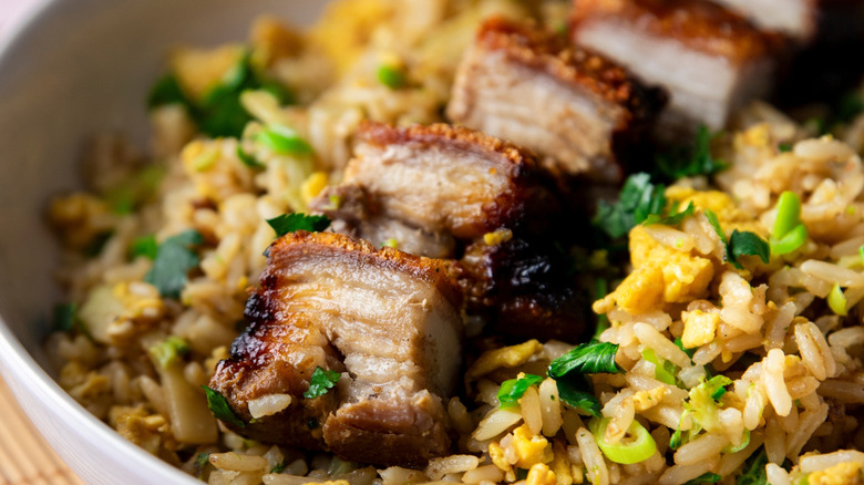 Fried rice topped with crispy pork belly