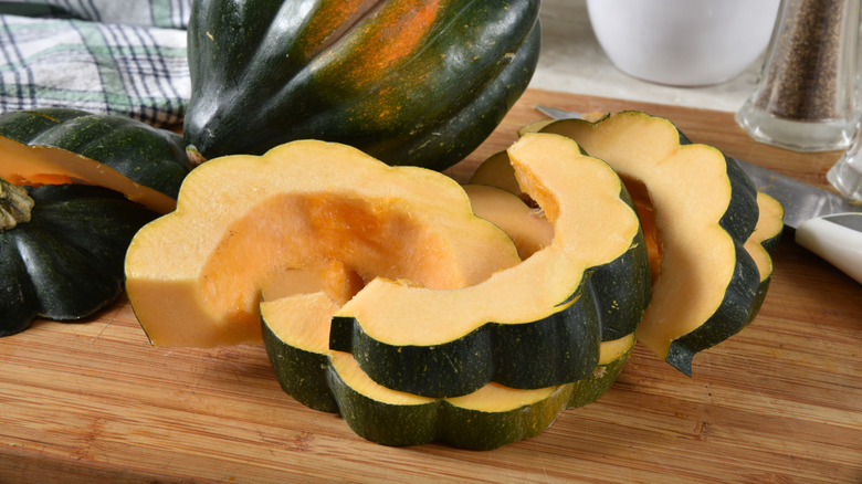 sliced acorn squash on a cutting board