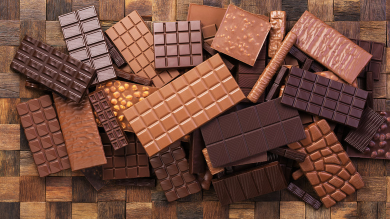 A scattered collection of different chocolate bars.
