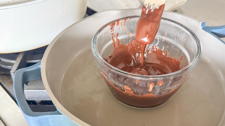 fork in melted chocolate