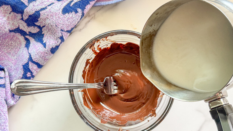 cream pouring into chocolate