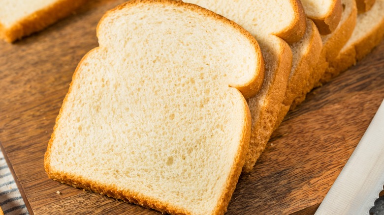 Sliced white bread on a cutting board
