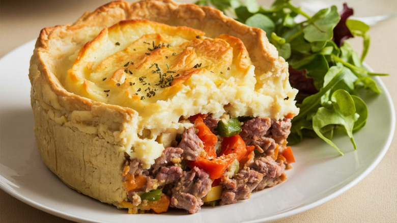 Shepherd's pie on a plate with greens