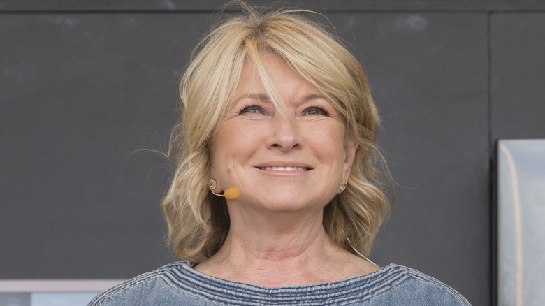Celebrity chef Martha Stewart smiling at an outdoor industry event