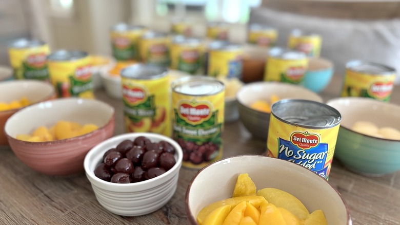 Del Monte canned fruit arranged on table