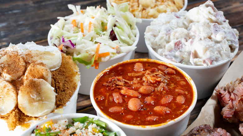 A row of deli containers with different side dishes