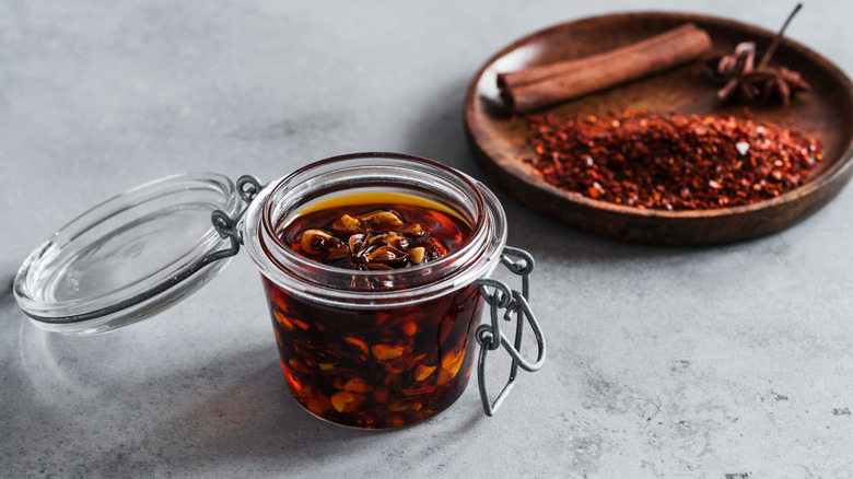 An open jar of homemade chili crisp.