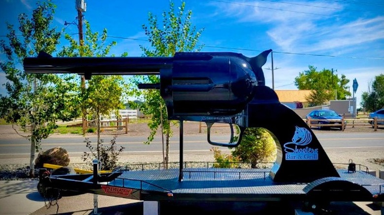 The gun-shaped smoker at Shooters Bar & Grill sitting outside the restaurant in Colorado.