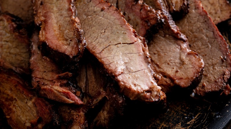 Slices of smoked brisket with light seasoning.
