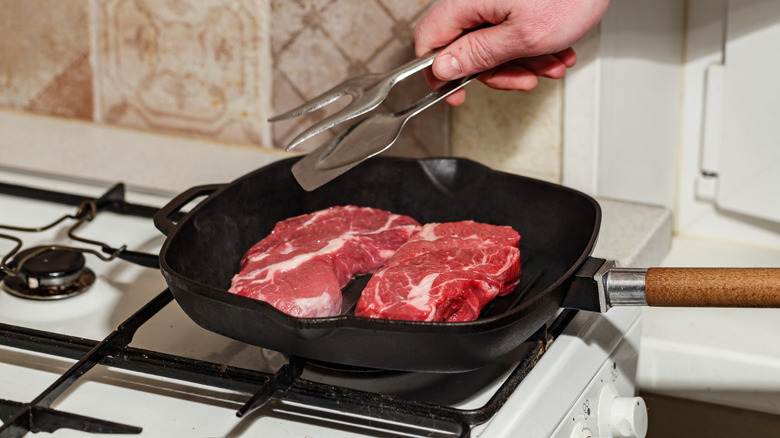 Denver steak being pan-seared