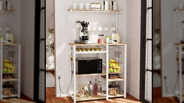 Microwave cart with coffee machine, fresh fruit, and wine glasses