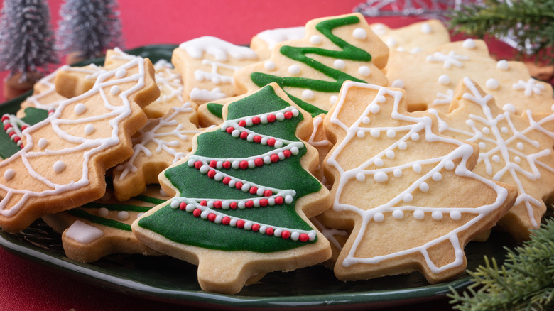 a plate of decorated christmas sugar cookies