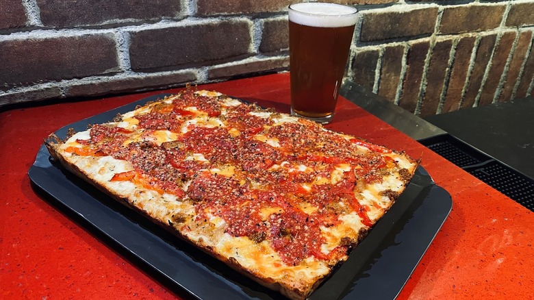 A slice of Detroit-style square pizza from Buddy's Pizza in Detroit