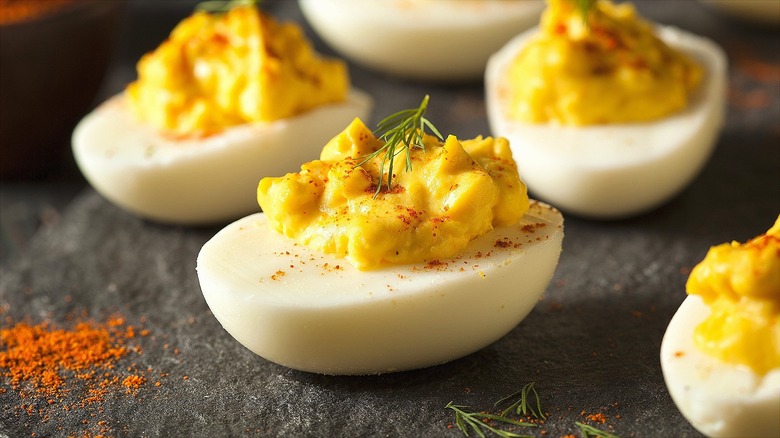 Close-up of deviled eggs with paprika and fresh dill