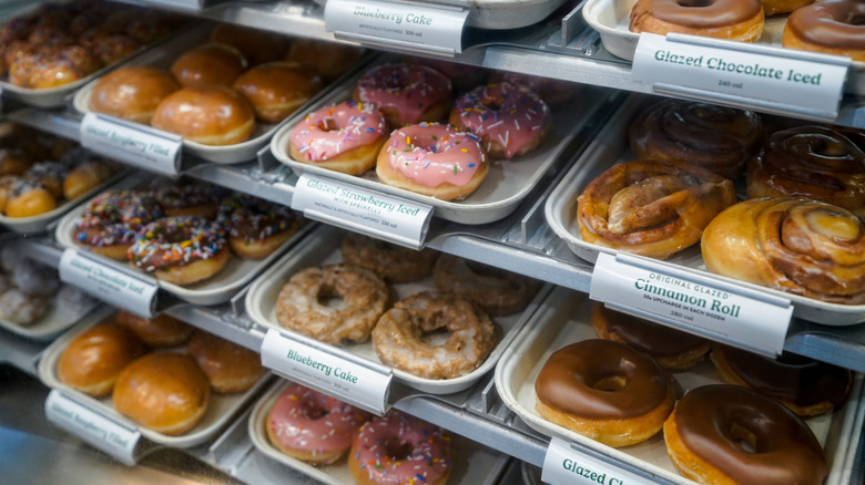 Shelves of krispy kreme donuts for sale