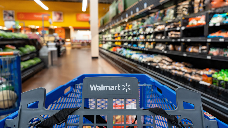 Walmart shopping cart going down an aisle