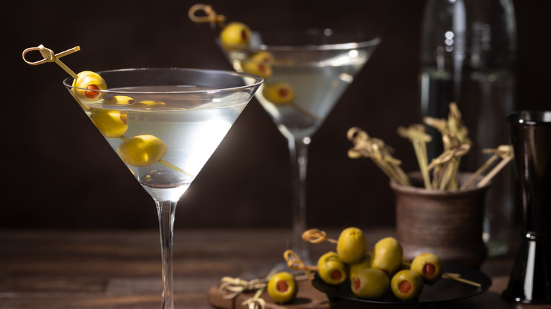 Two dirty martinis with olives