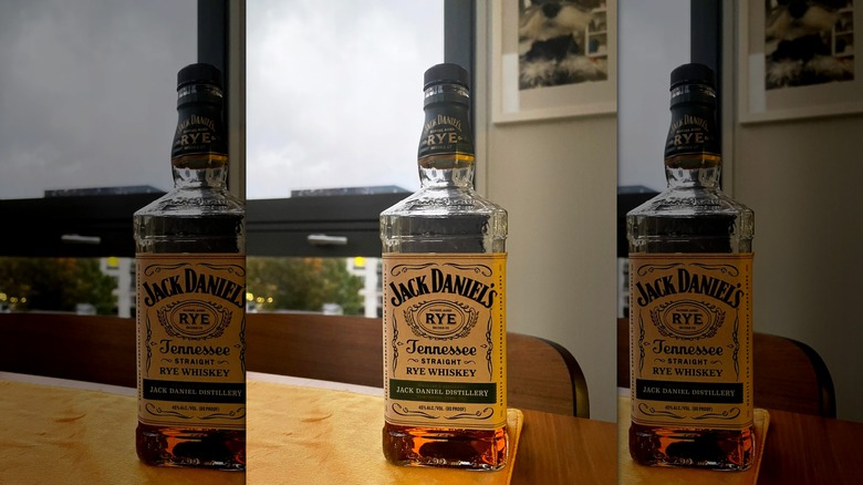 A bottle of Jack Daniel's Tennessee Straight Rye Whiskey with a glass