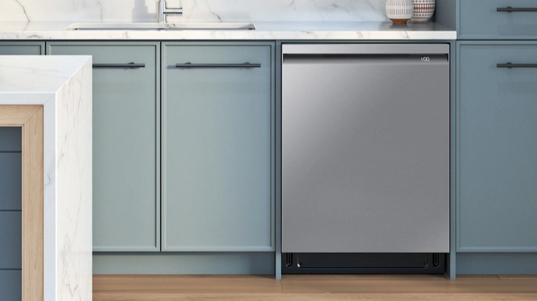 Samsung dishwasher installed in a kitchen with light blue cabinets