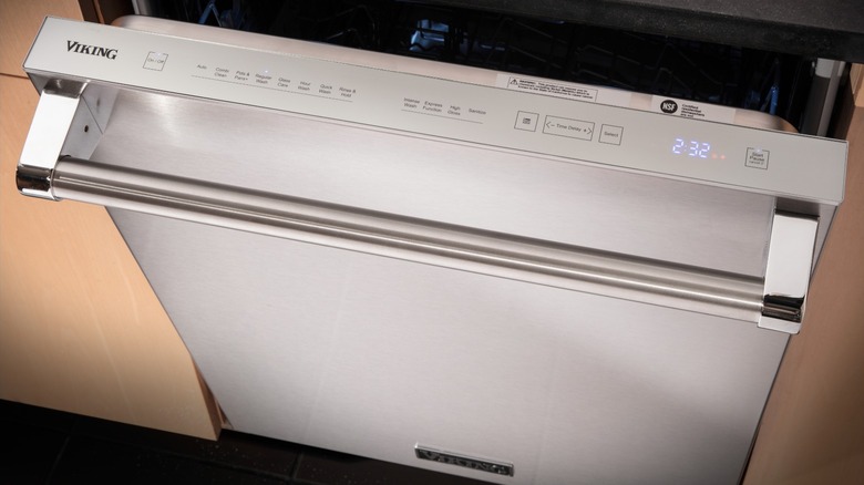 Viking dishwasher slightly open to reveal controls