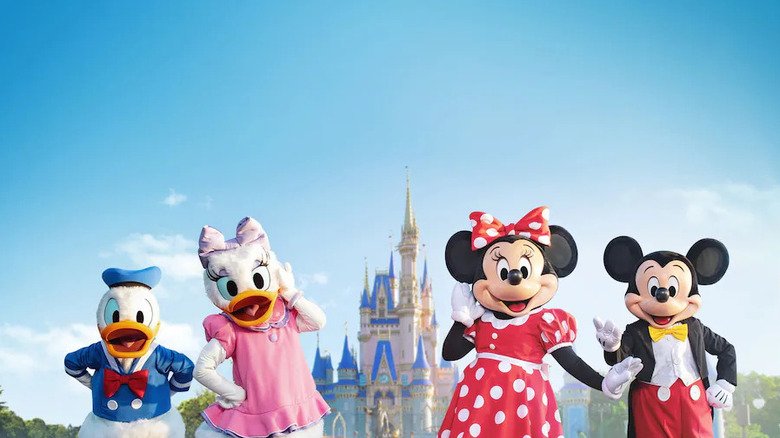 Mickey, Minnie, Donald, and Daisy Duck in front of Cinderella Castle