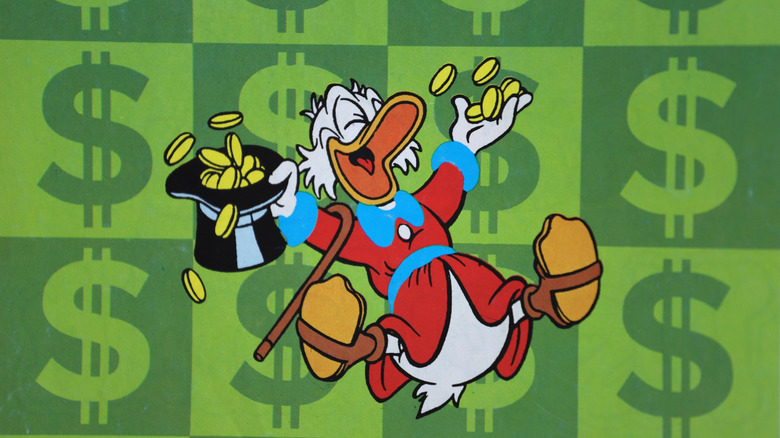 Donald Duck laughing with coins in his hands