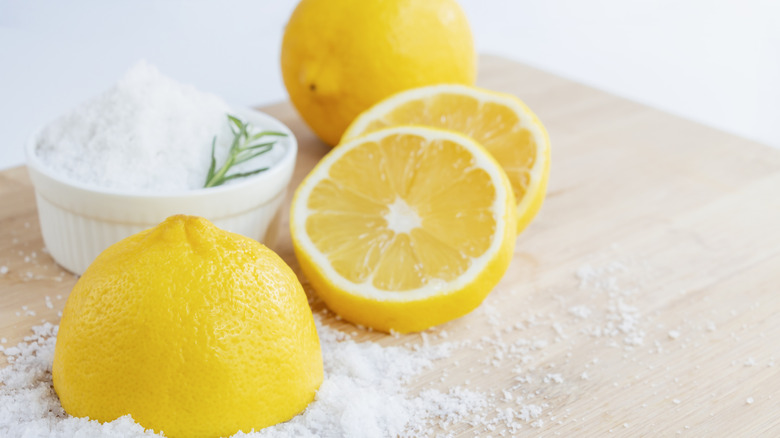 sliced lemon beside a ramekin of salt
