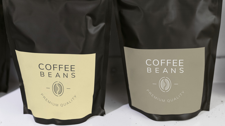 Two vacuum-sealed coffee bags, written on the labels: Coffee Beans, Premium Quality