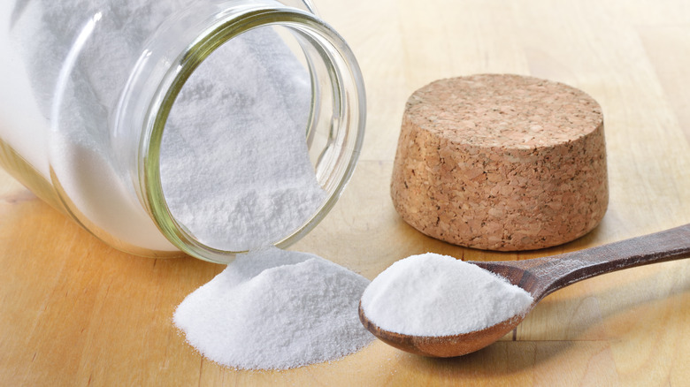 baking soda spilling from jar 
