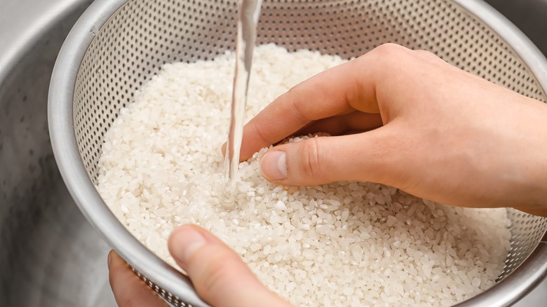 rinsing rice in sink