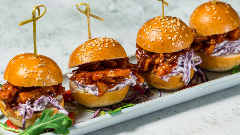 Pulled pork sliders on a white slider tray