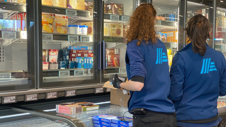 Aldi employees stocking the store