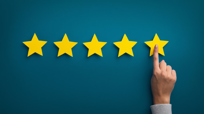 pointing to five star rating