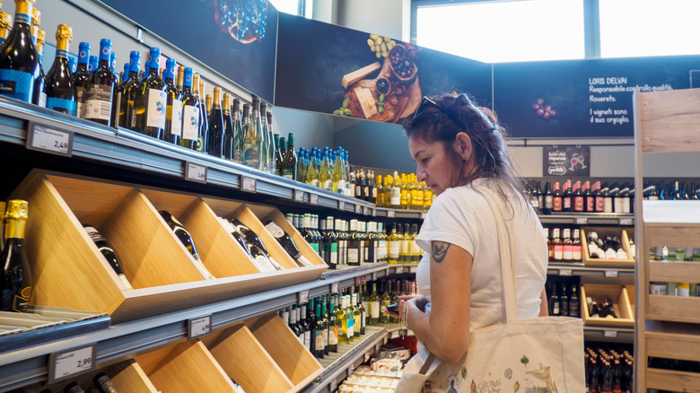 Woman shops Aldi liquor section
