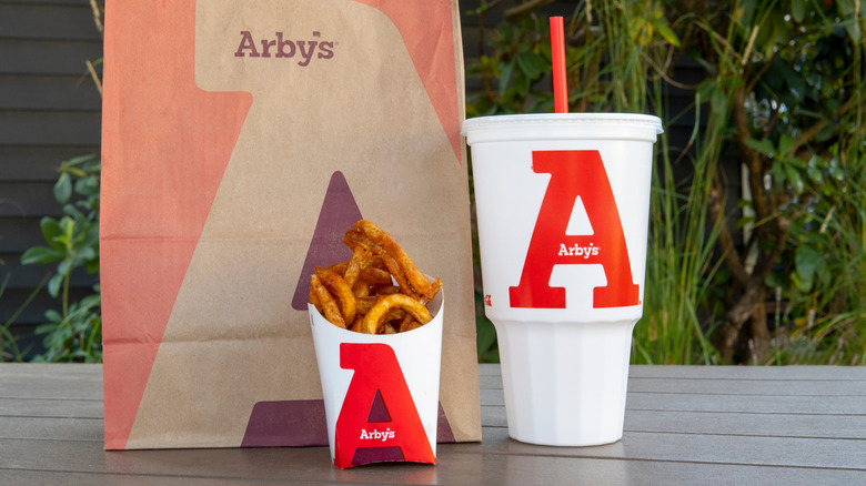 Arby's takeout bag with fries and drink