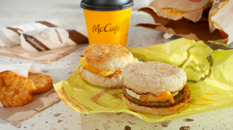McDonald's breakfast including Egg McMuffins, hash browns, and a McCafé coffee