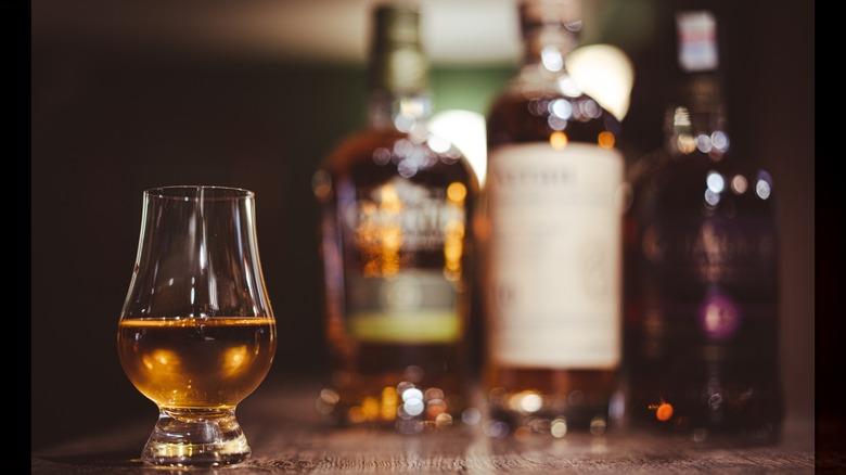 A Gelncairn glass of whiskey with bottles