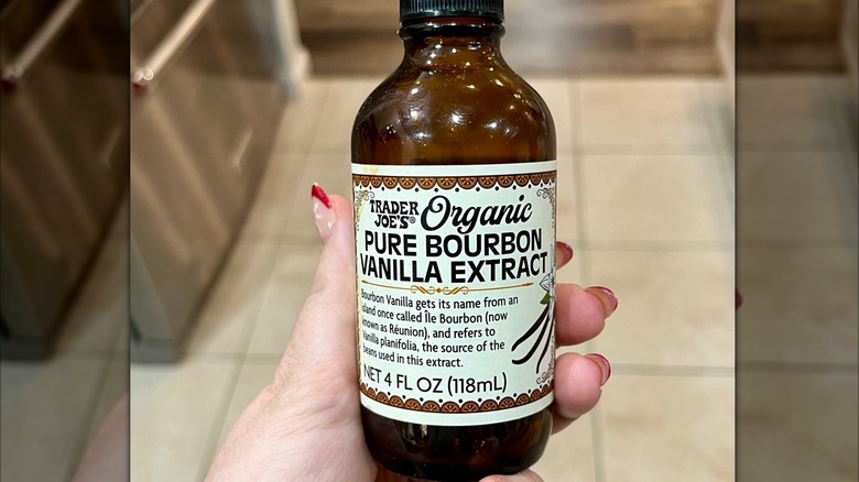 Person holding Trader Joe's Bourbon Vanilla Extract