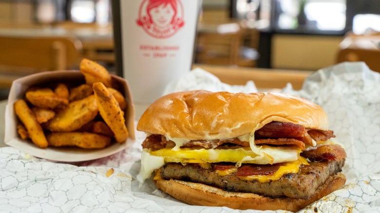 Wendy's Breakfast Baconator with potato wedges and coffee