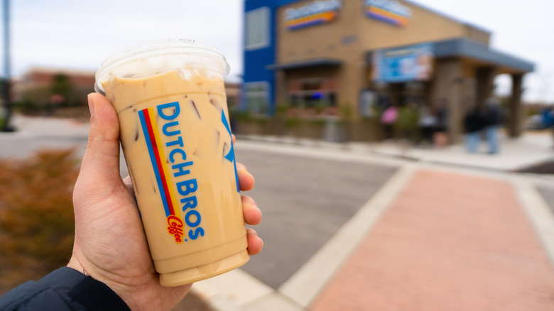 Hand holding Dutch Bros cup