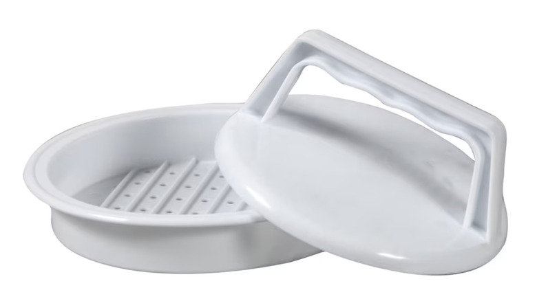 Plastic burger press