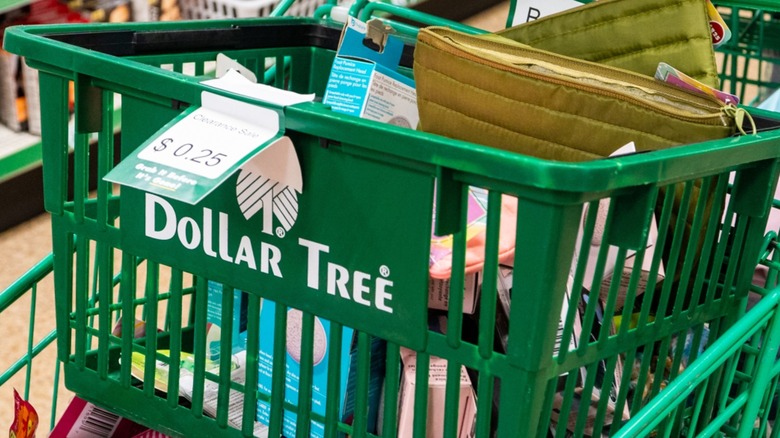 Green shopping carts and basket with a Dollar Tree logo filled with items.