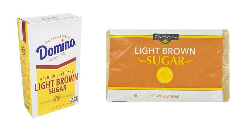A box of Domino light brown sugar and a bag of Clover Valley light brown sugar on a white background