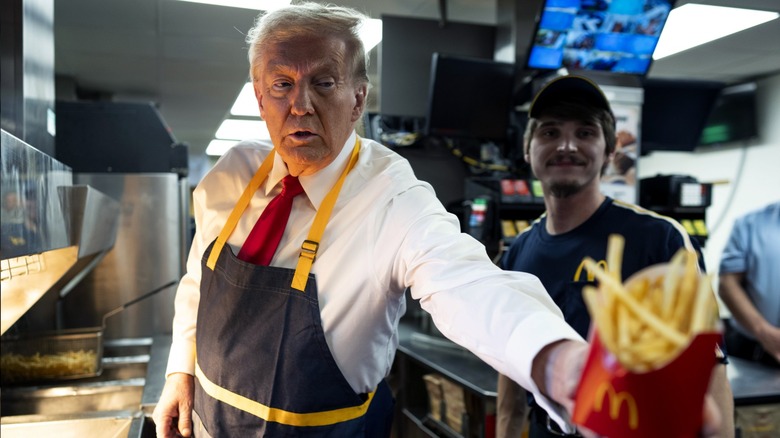 Donald Trump serving fries at a McDonald's restaurant