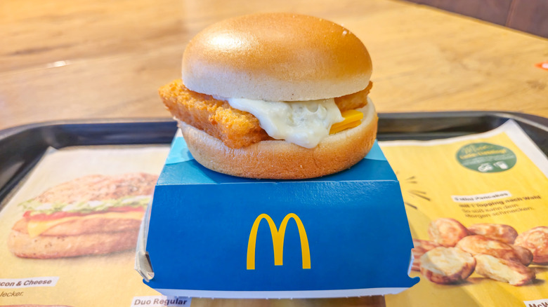 Filet-O-Fish sandwich on top of its box